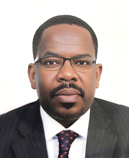 H.E. Khamis Mussa Omar - Ambassador